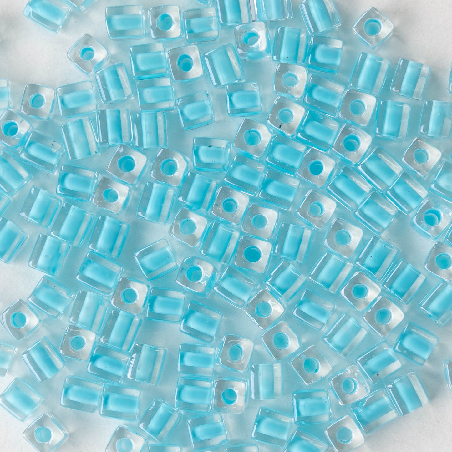 4mm Miyuki Cube Beads  - Lt Aqua Blue Blue Lined Crystal