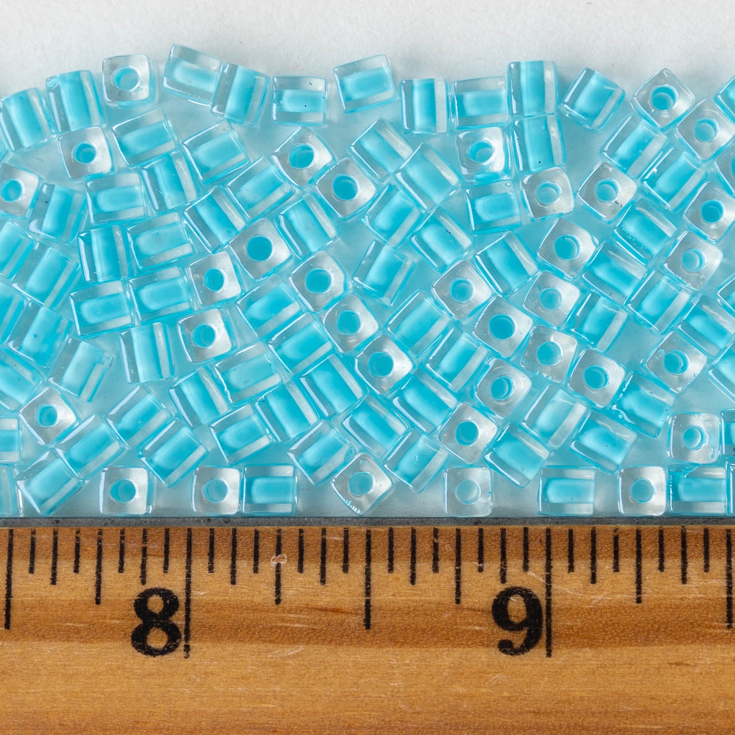 4mm Miyuki Cube Beads  - Lt Aqua Blue Blue Lined Crystal