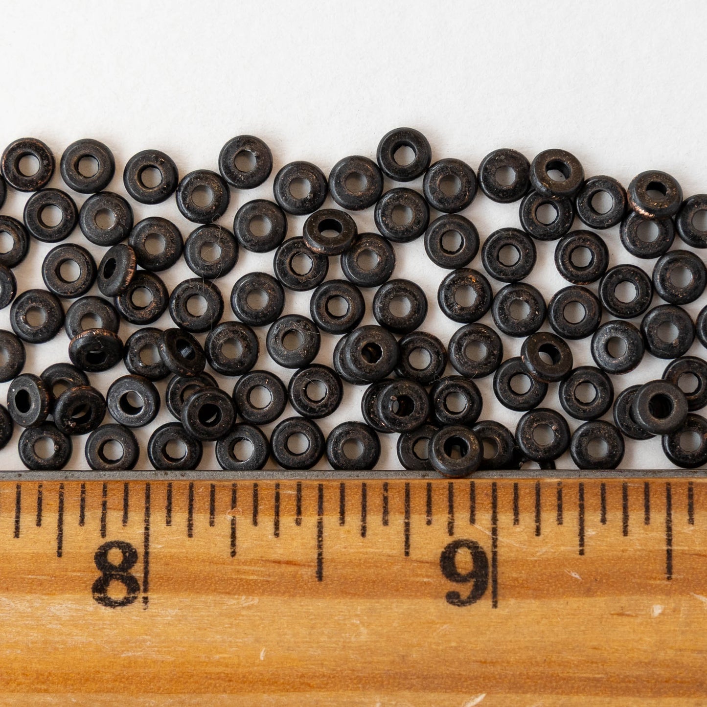 4mm Metal Disk Beads - Black Brass - 4 inch strand ~75 beads