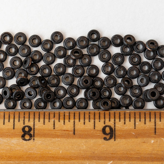 4mm Metal Disk Beads - Black Brass - 4 inch strand ~75 beads