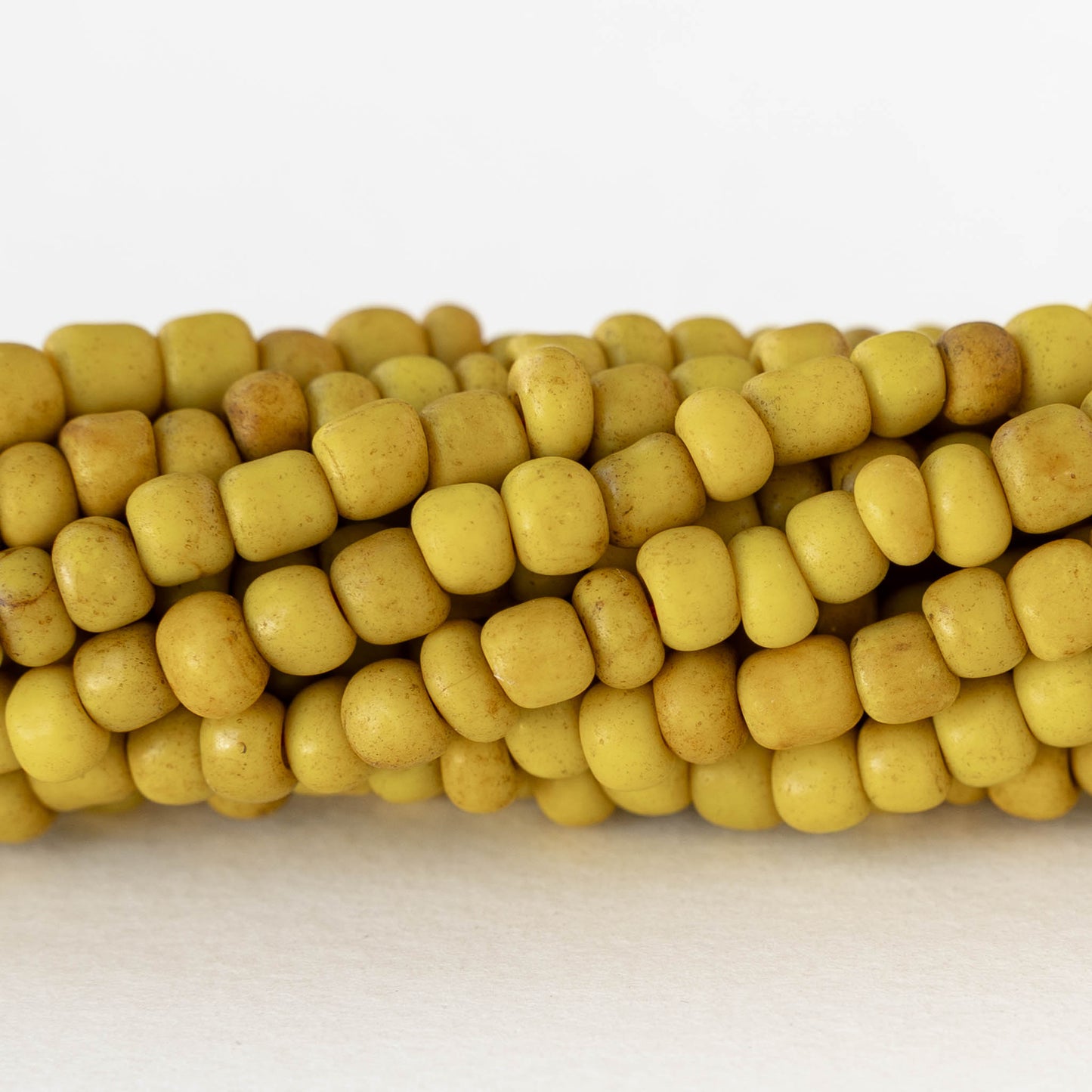 4mm Rustic Indonesian Glass Seed Beads - Opaque Yellow - Whole or Half Strand