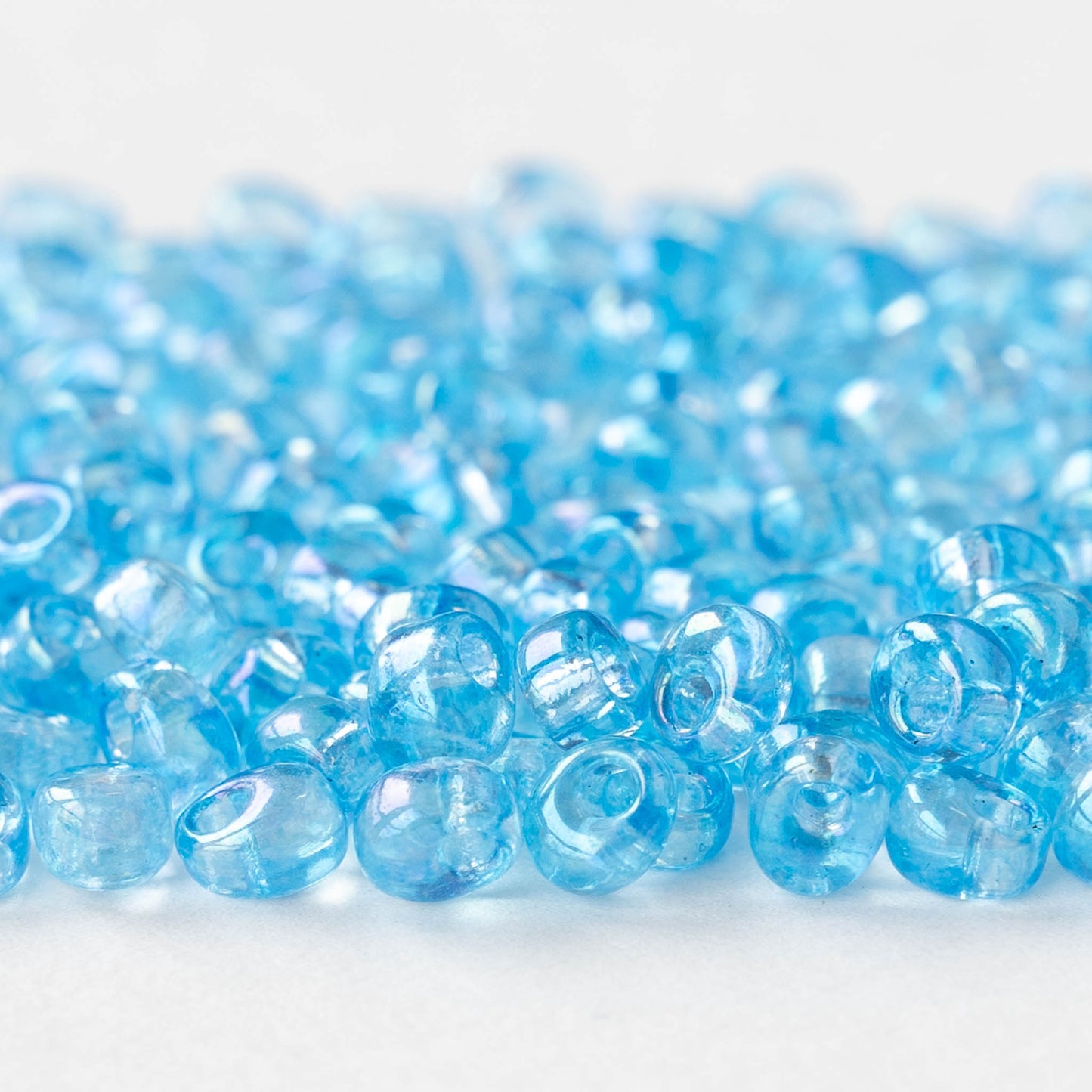 4mm Glass Magatama Teardrops - Transparent Light Blue Aqua AB - 24 grams