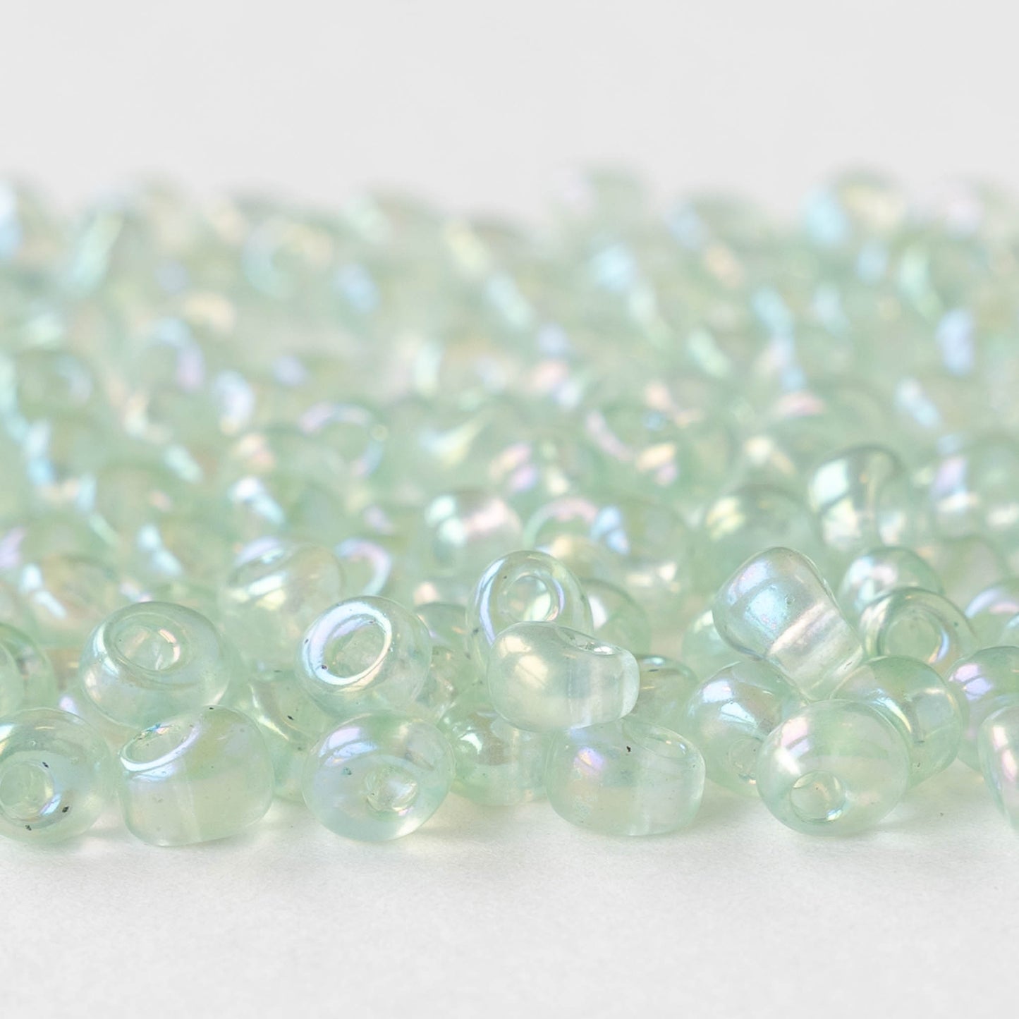 4mm Glass Magatama Teardrops - Transparent Pale Green AB - 24 grams