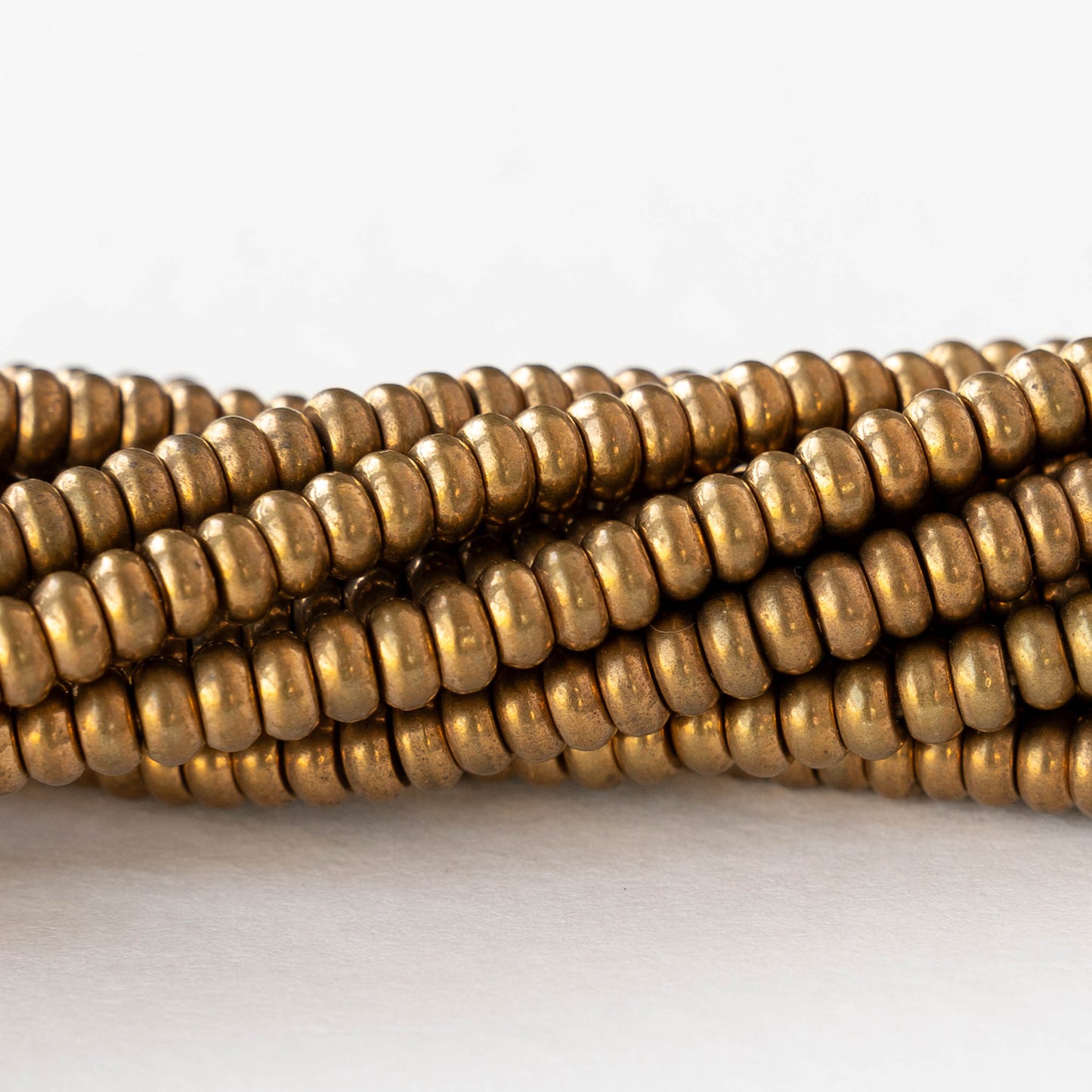 4mm Metal Rondelle Beads - Brass - 4 inches ~35 beads