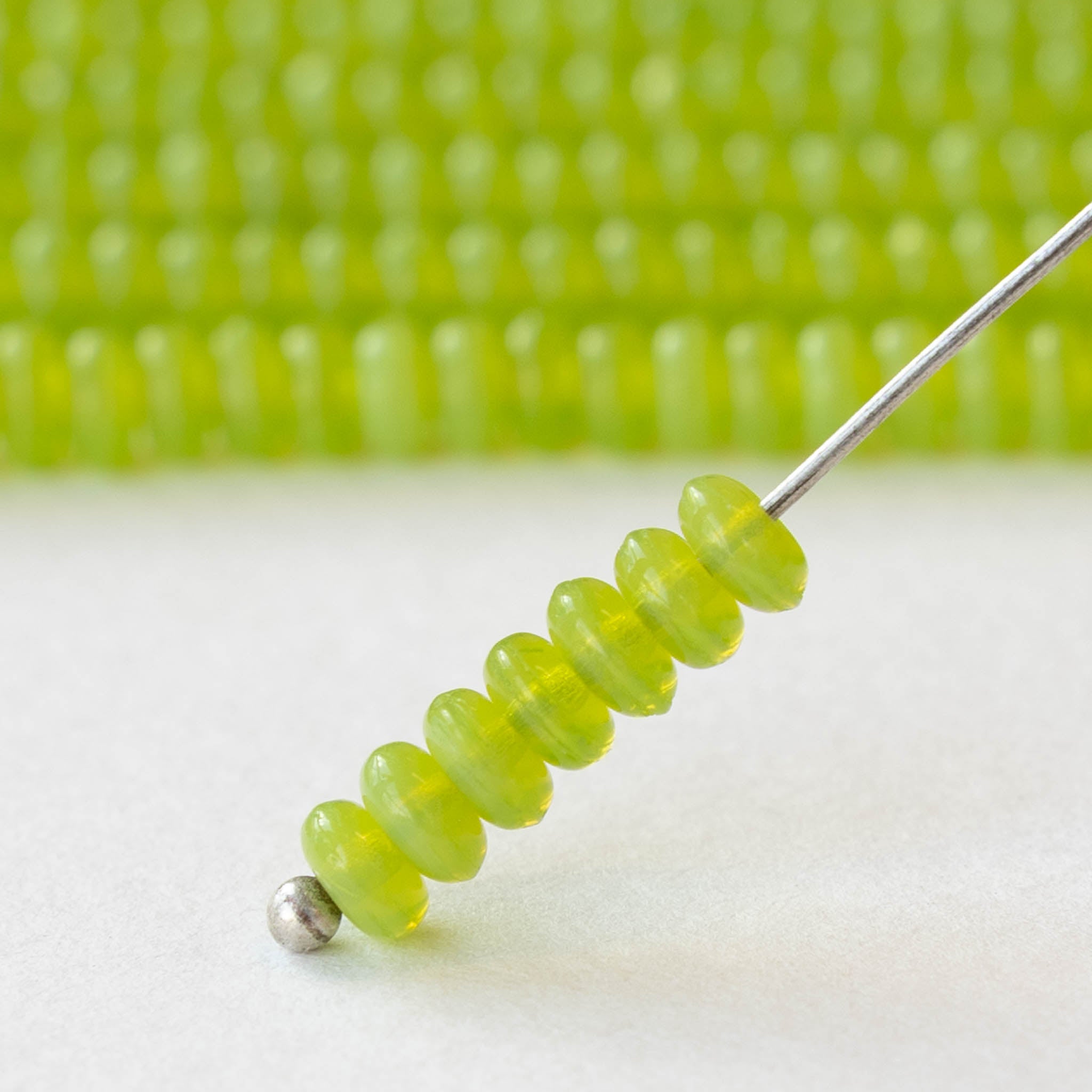 thumbnail interactive-video image 1 of 25x 8mm Opaque Olive Green Glass Faceted Rondelle Beads 1 of 5