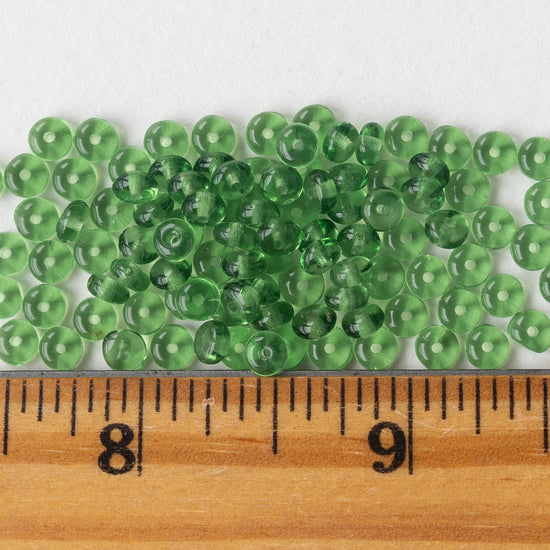 https://funkyprettybeads.com/cdn/shop/files/4mm-rondelle-bead-kelly-green-5_550x.jpg?v=1687019571