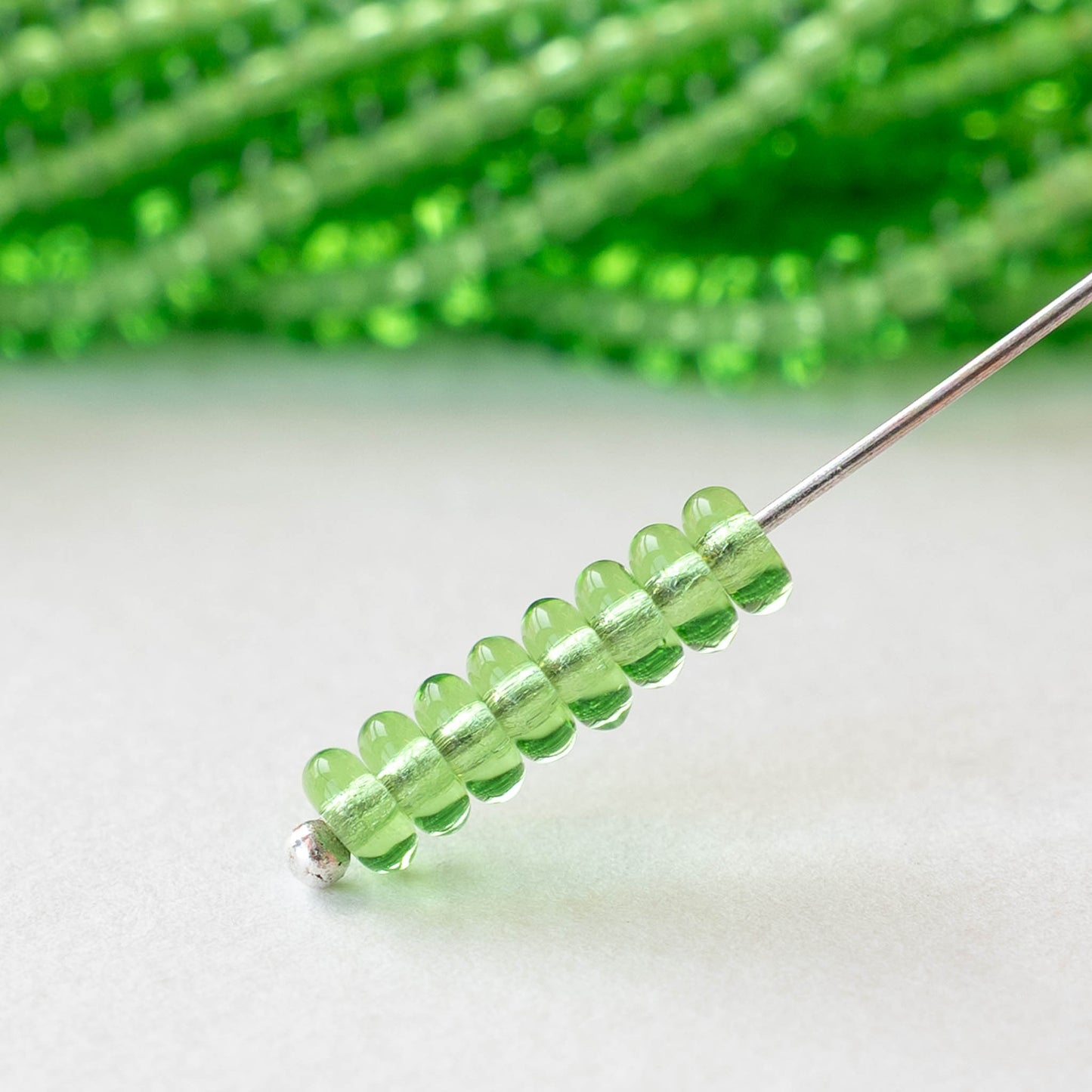 4mm Glass Rondelle Beads - Transparent Peridot Green - 100 beads
