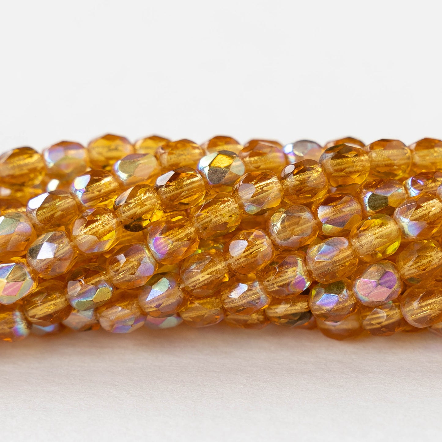 4mm Round Faceted Glass Beads - Transparent Amber AB - 50 Beads