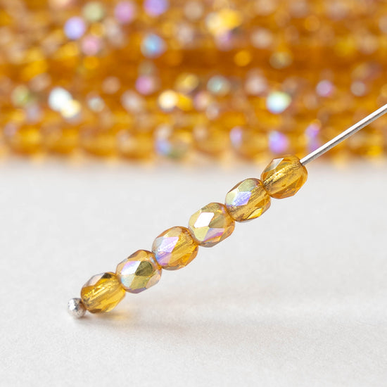 4mm Round Faceted Glass Beads - Transparent Amber AB - 50 Beads