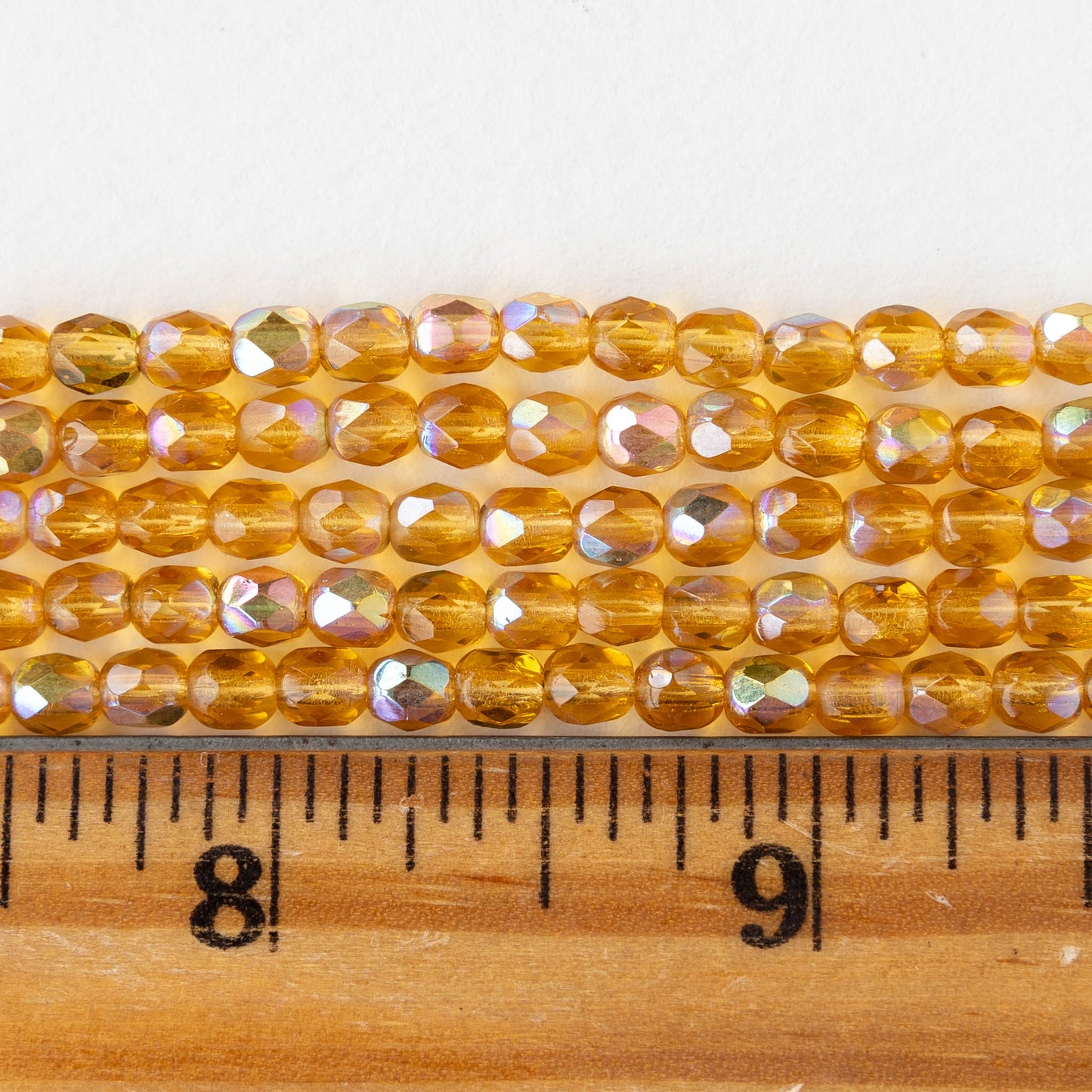 4mm Round Faceted Glass Beads - Transparent Amber AB - 50 Beads