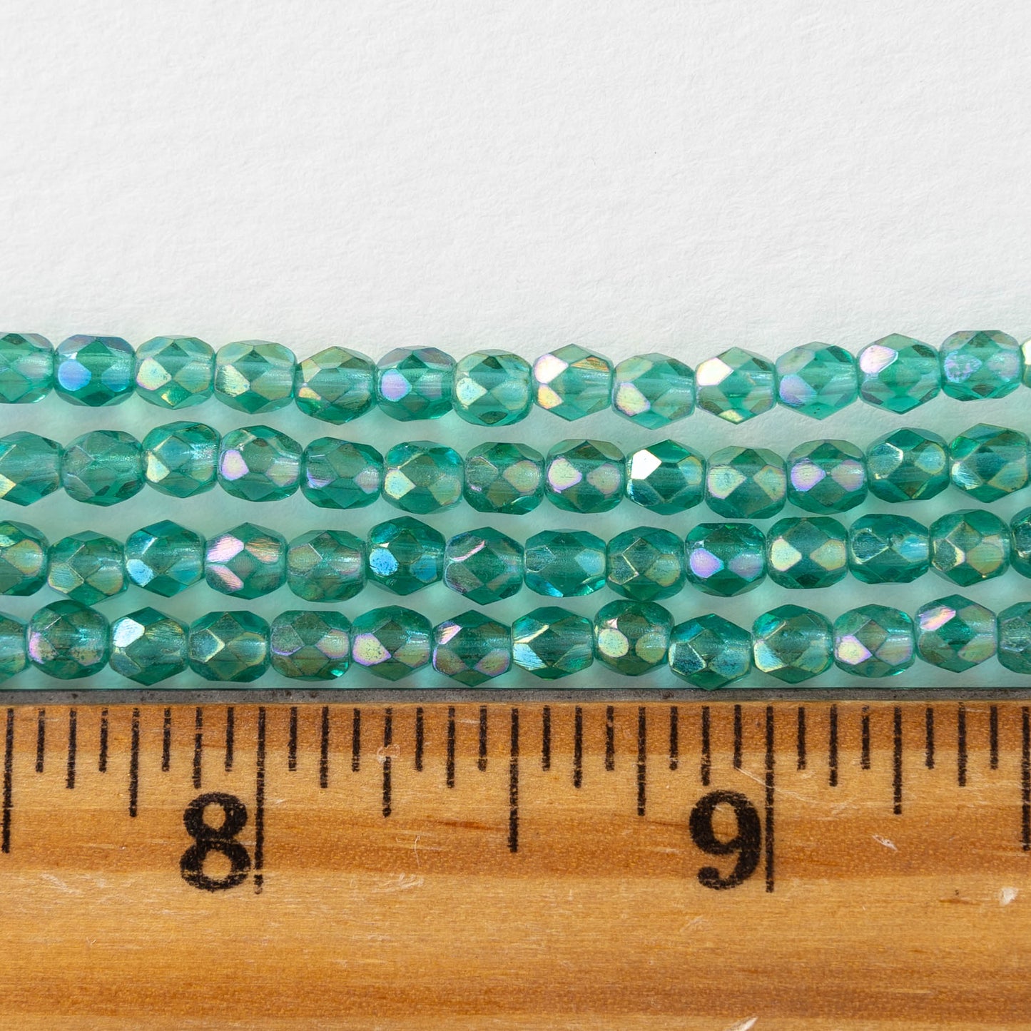 4mm Round Faceted Glass Beads - Transparent Emerald Luster - 50 Beads