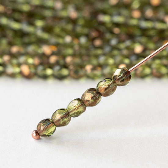 4mm Round Faceted Glass Beads - Transparent Olivine with Bronze - 50 Beads