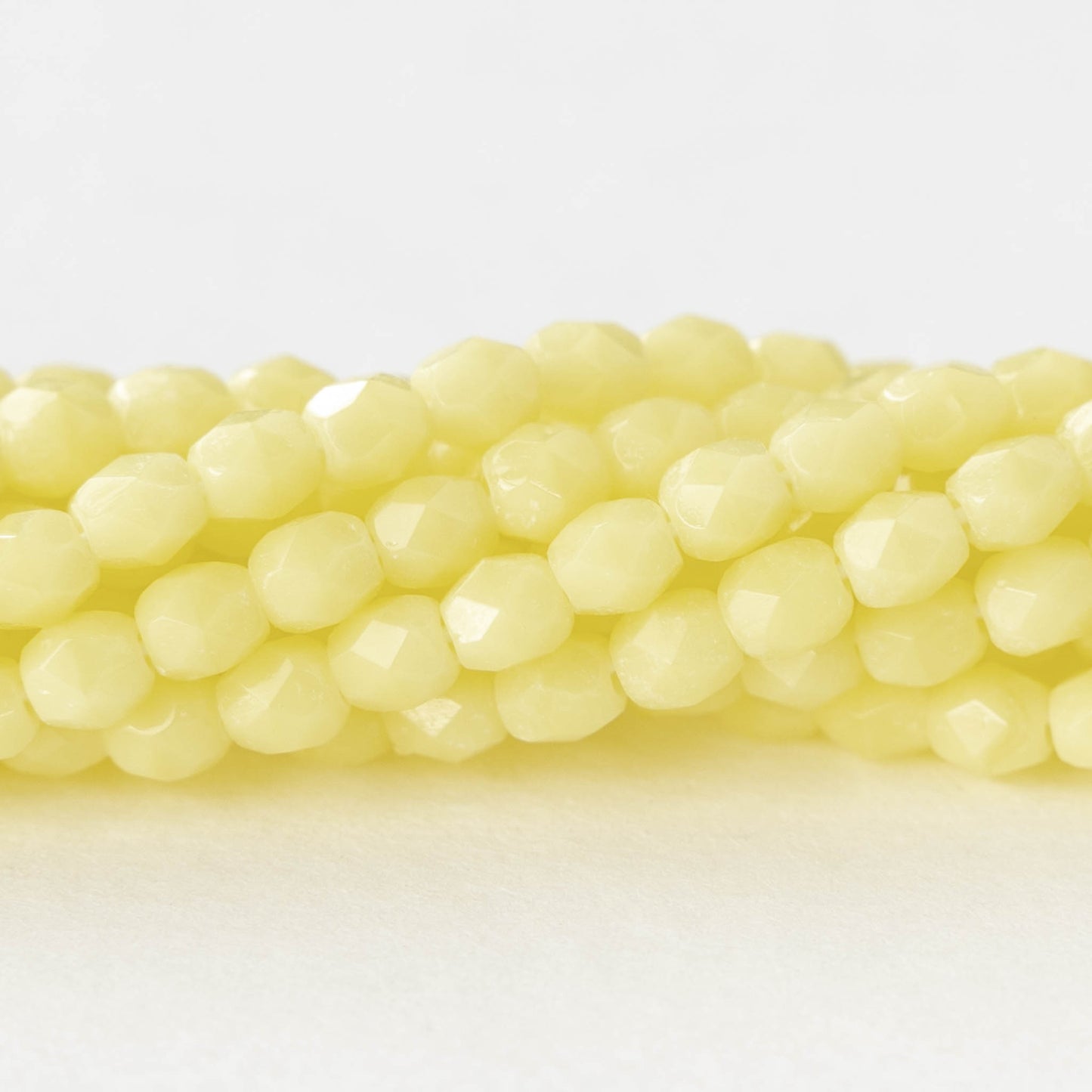 4mm Faceted Round Beads - Opaque Pale Yellow  - 50 beads