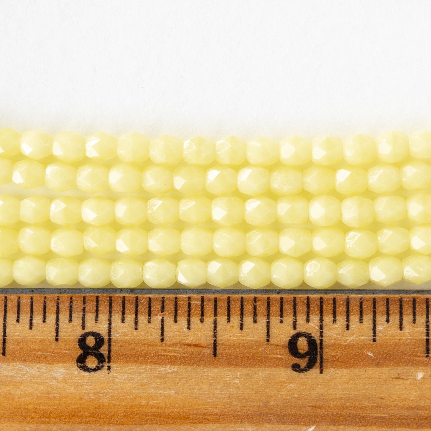 4mm Faceted Round Beads - Opaque Pale Yellow  - 50 beads