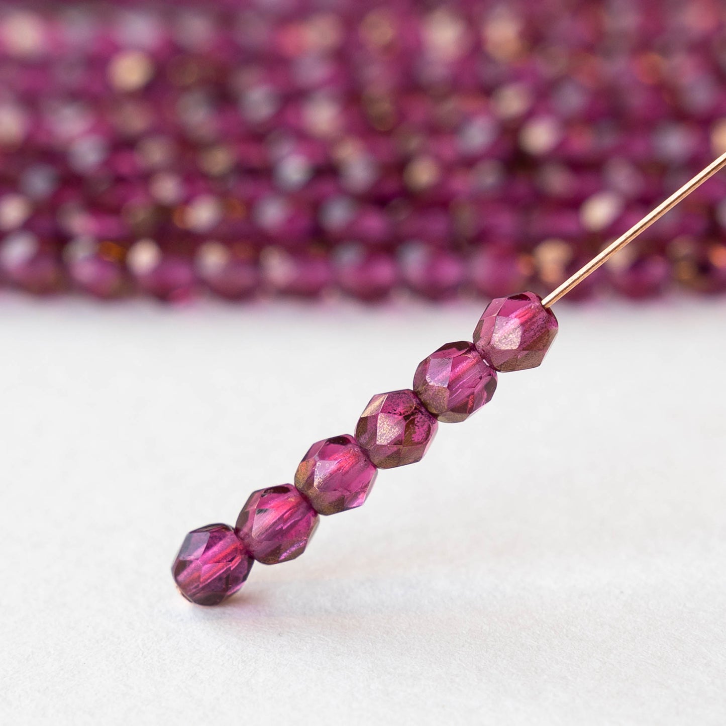 4mm Round Faceted Glass Beads - Transparent Raspberry Bronze Luster - 50 Beads