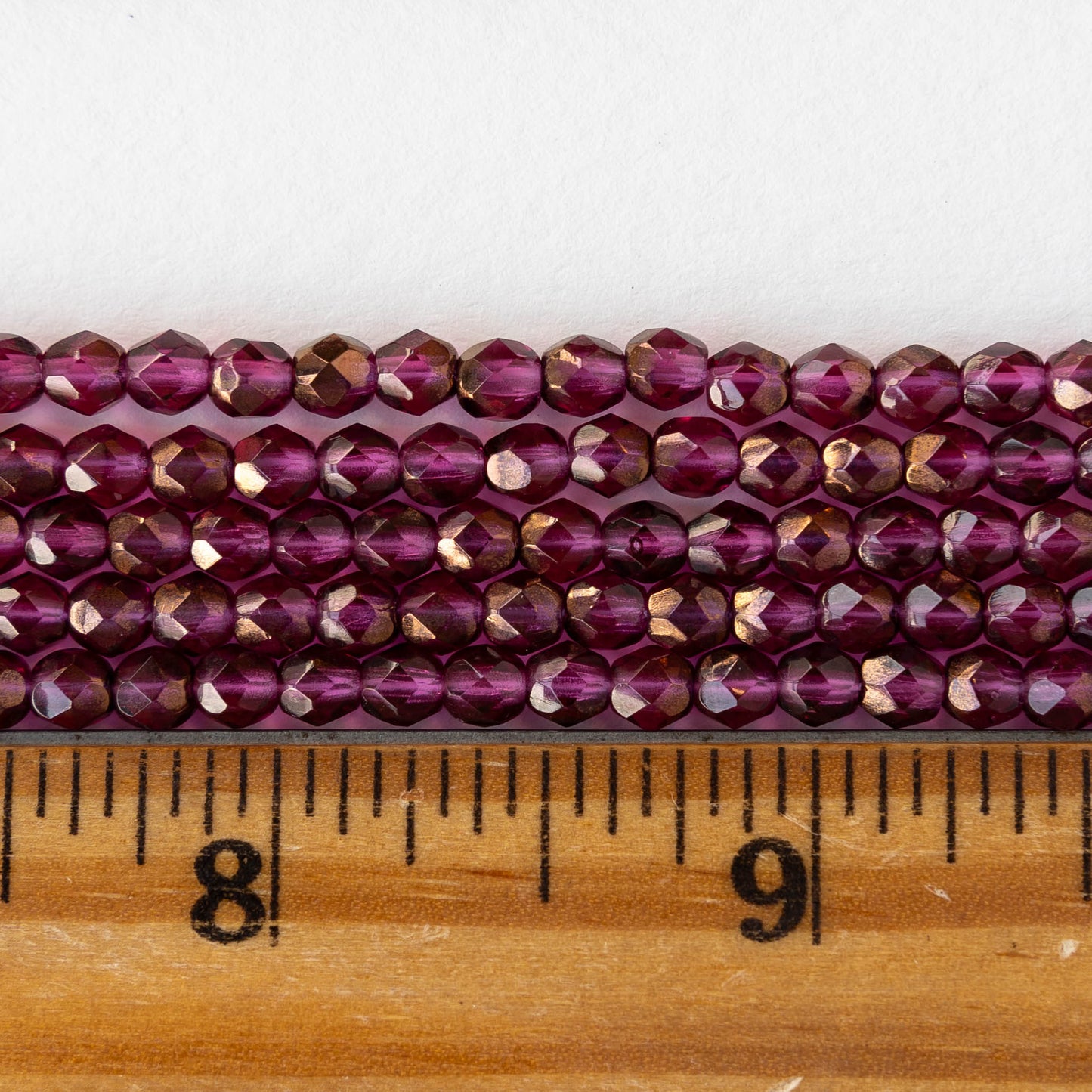 4mm Round Faceted Glass Beads - Transparent Raspberry Bronze Luster - 50 Beads