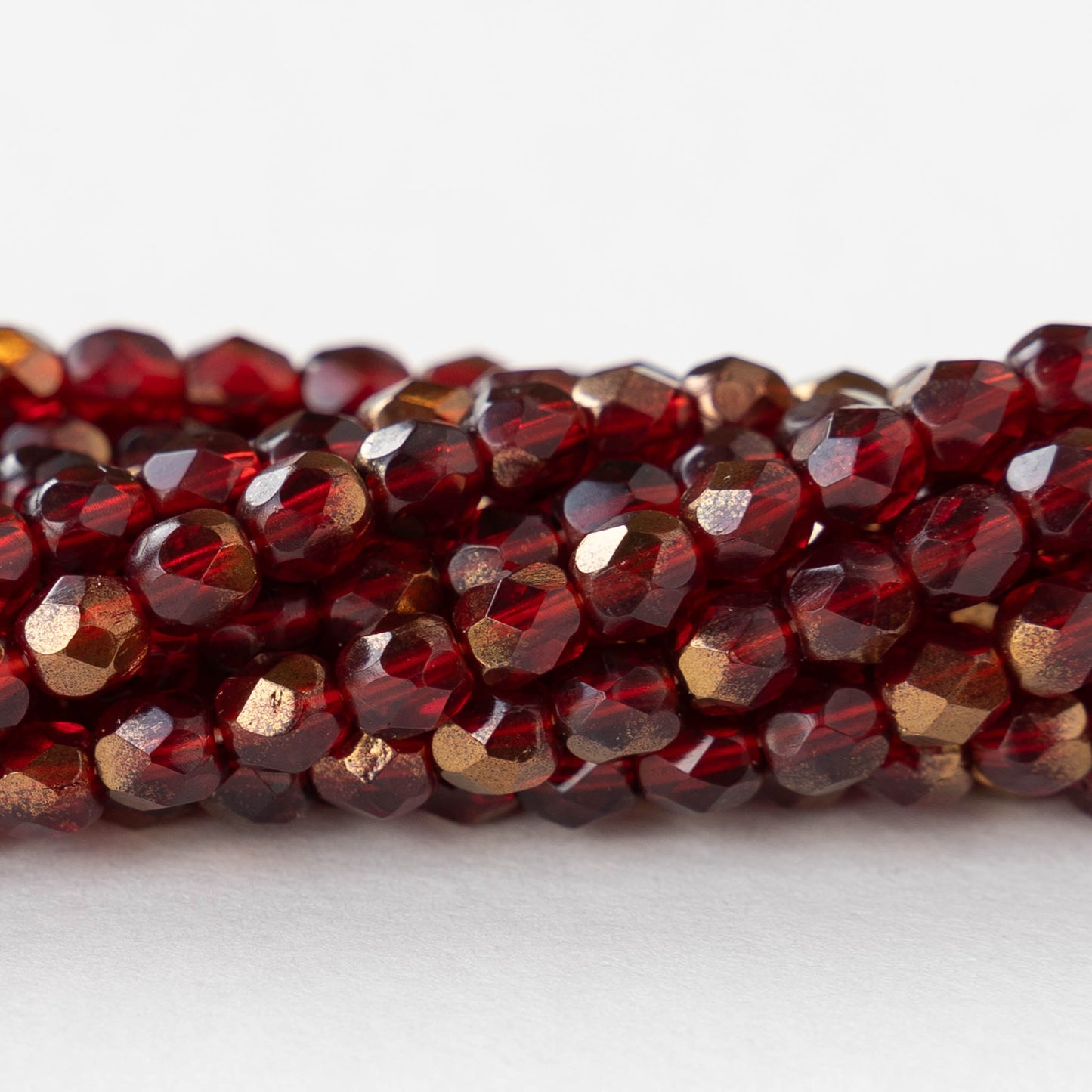 4mm Round Faceted Glass Beads - Transparent Red with Bronze - 50 Beads