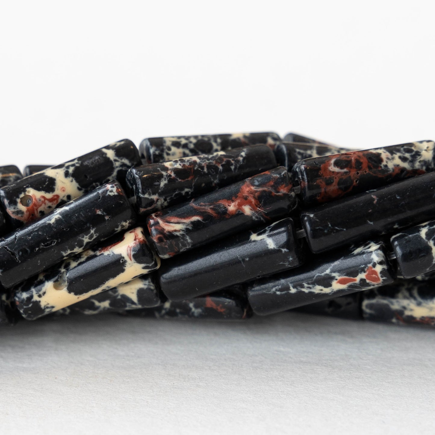 4x14mm Impression Jasper Tube Beads - Black - 28 beads