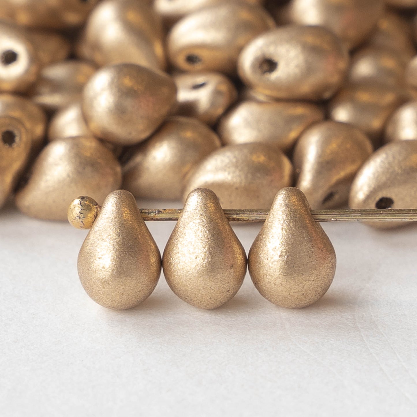 Load image into Gallery viewer, 5x7mm Glass Teardrop Beads - Gold Matte - 120 Beads
