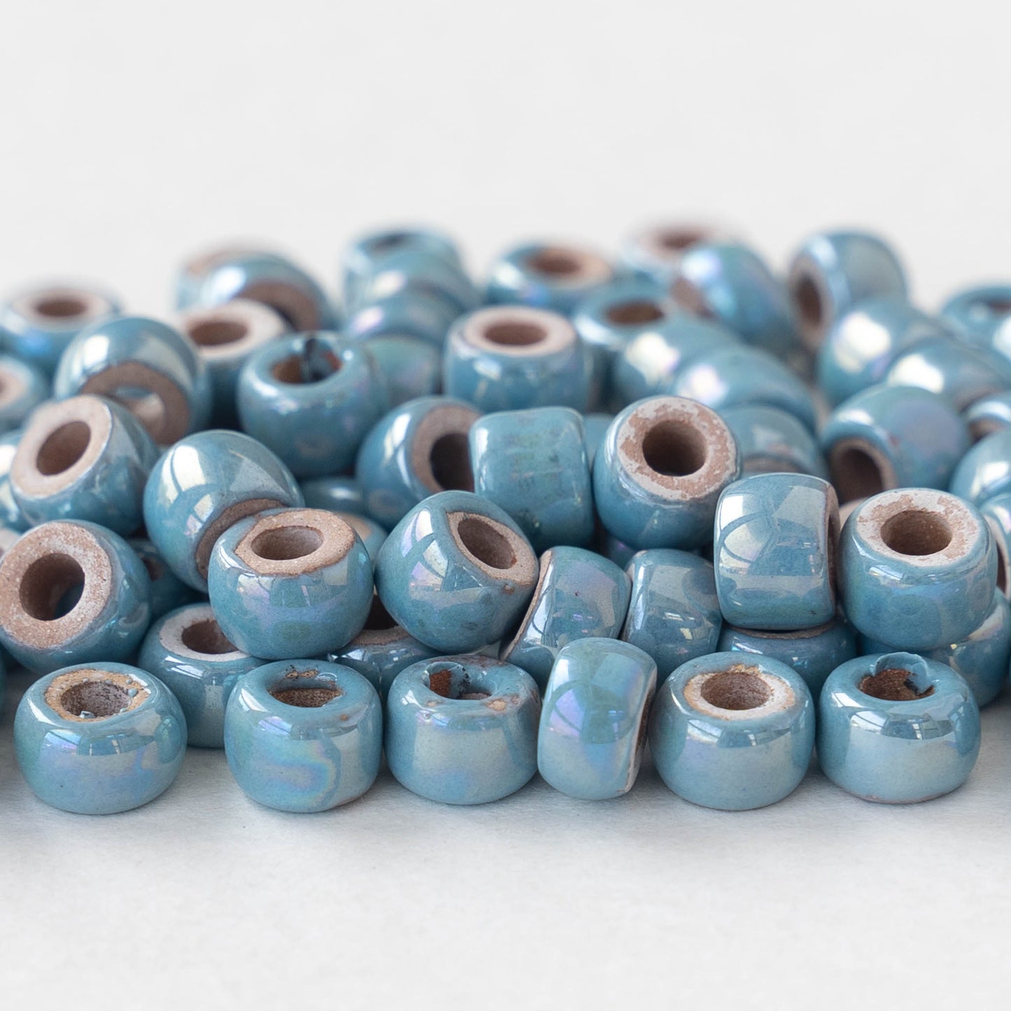 Load image into Gallery viewer, 4x6mm Glazed Ceramic Tube Beads - Iridescent Light Blue - 10 or 30
