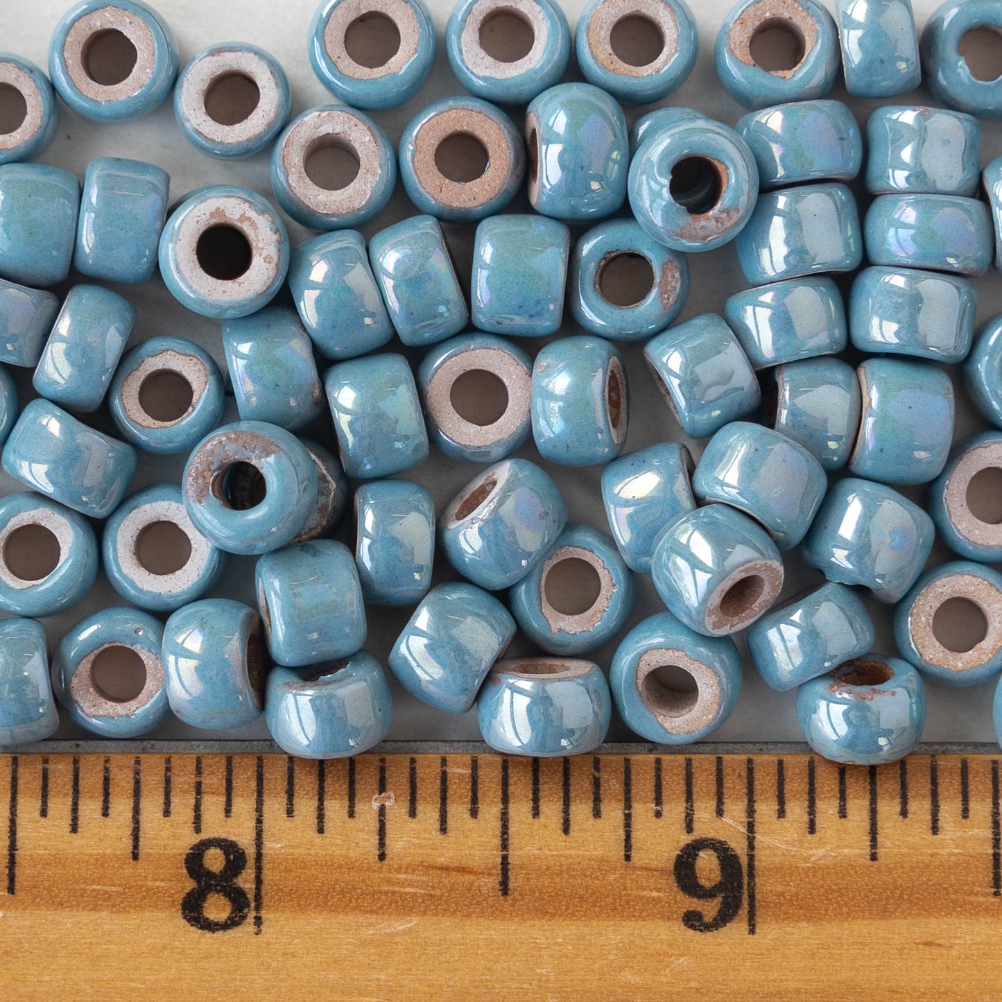 Load image into Gallery viewer, 4x6mm Glazed Ceramic Tube Beads - Iridescent Light Blue - 10 or 30
