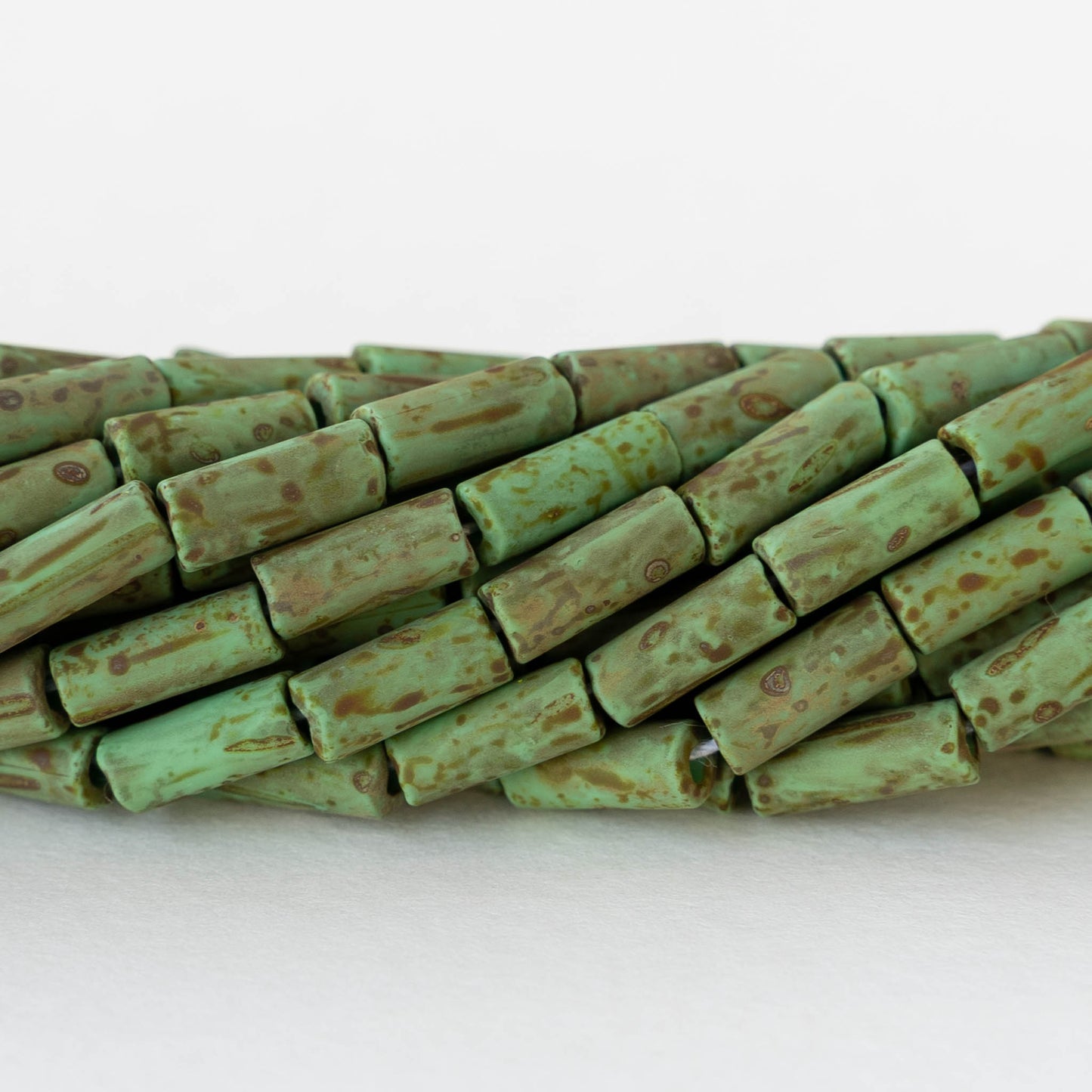 4x9mm Glass Bugle Beads - Matte Opaque Jade Picasso - 20 inch strand ~60 beads