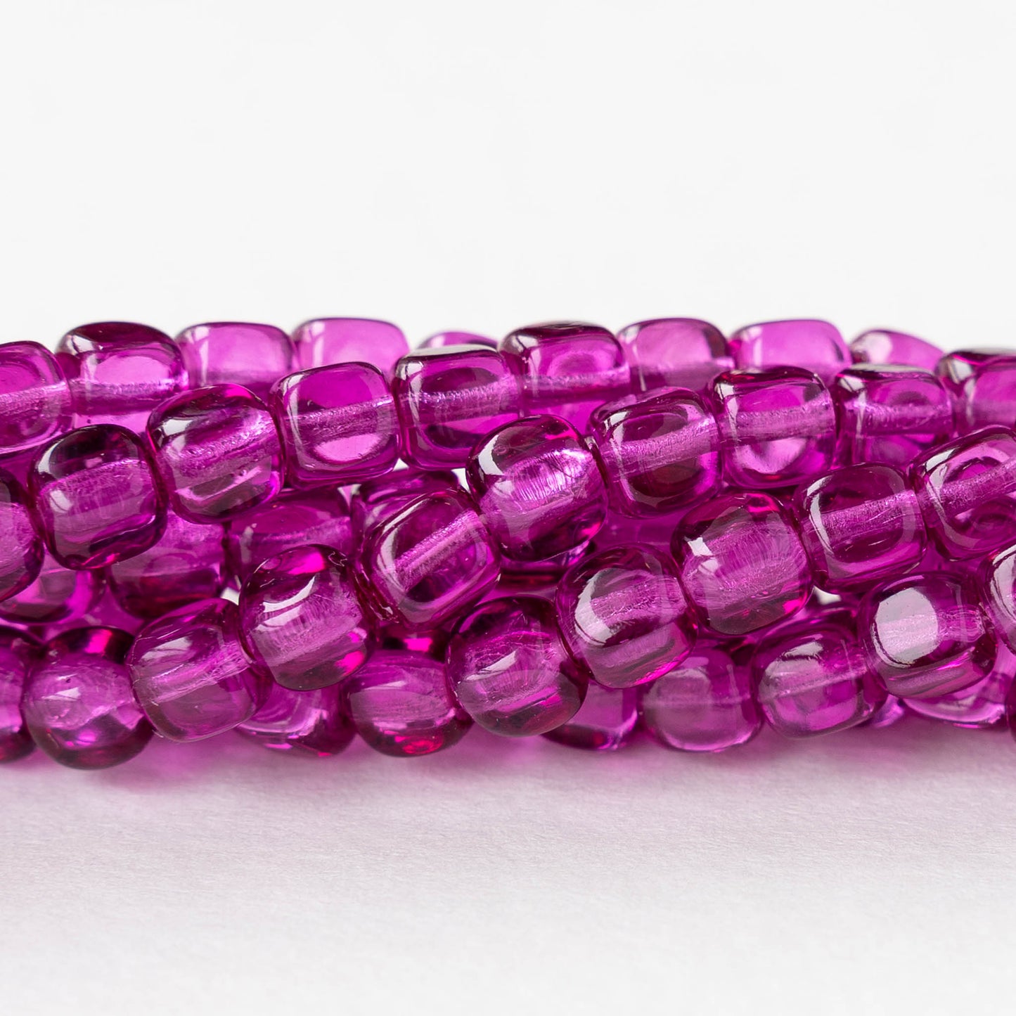 5mm Glass Cube Beads - Transparent Magenta - 15 inch strand - 80 beads