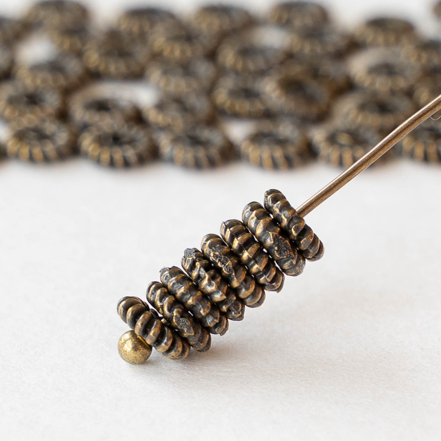 5mm Mykonos Coil Spacer Beads - Antique Brass - 10 or 20 beads