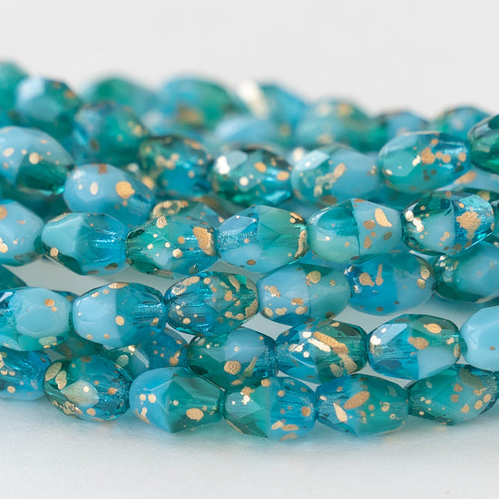 Load image into Gallery viewer, 5x7mm Oval Beads - Aqua and Teal with Gold Dust - 20 beads
