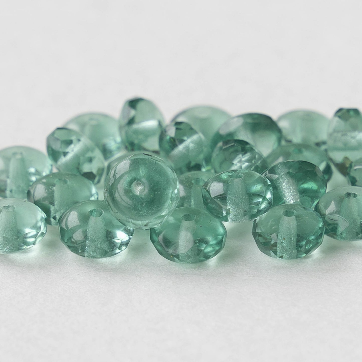 Load image into Gallery viewer, 5x7mm Rondelle Beads - Transparent Green Tourmaline - 25 Beads

