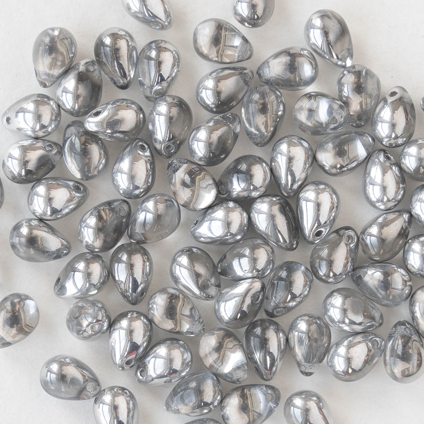 Load image into Gallery viewer, 5x7mm Glass Teardrop Beads - Crystal with Silver Coat - 75 Beads
