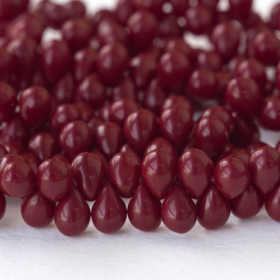 Load image into Gallery viewer, 5x7mm Glass Teardrop Beads - Opaque Maroon - 50 beads

