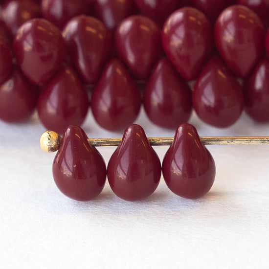 Load image into Gallery viewer, 5x7mm Glass Teardrop Beads - Opaque Maroon - 50 beads
