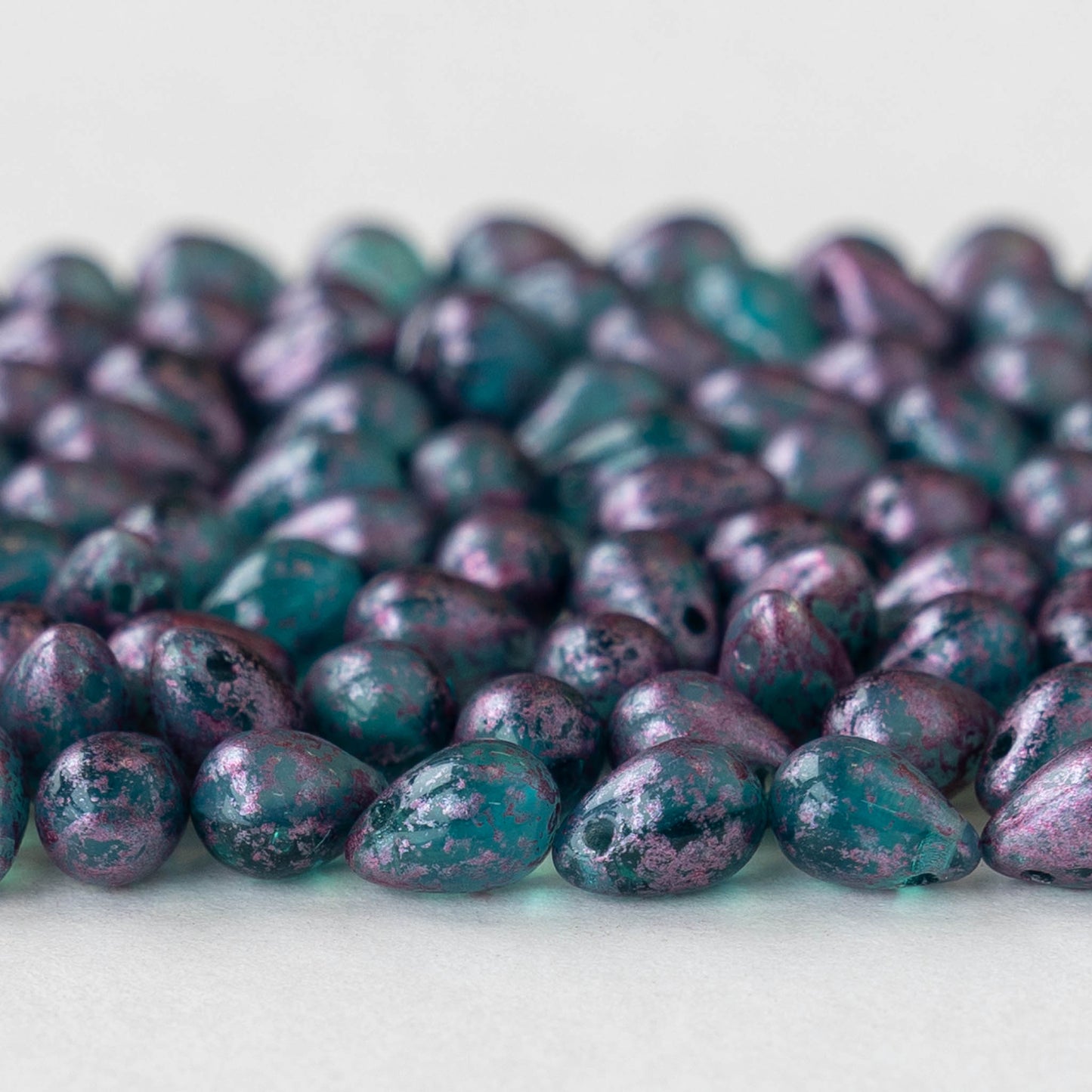 Load image into Gallery viewer, 5x7mm Glass Teardrop Beads - Teal with Metallic Pink Dust - 50 Beads
