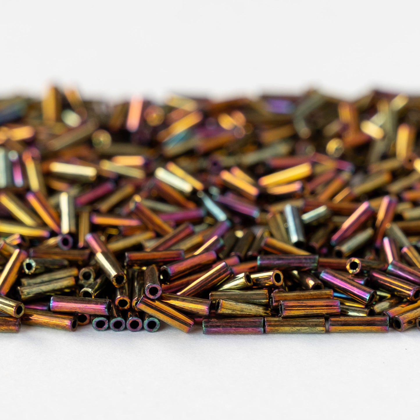 6mm Glass Bugle Beads - Metallic Gold Iris - 5 grams