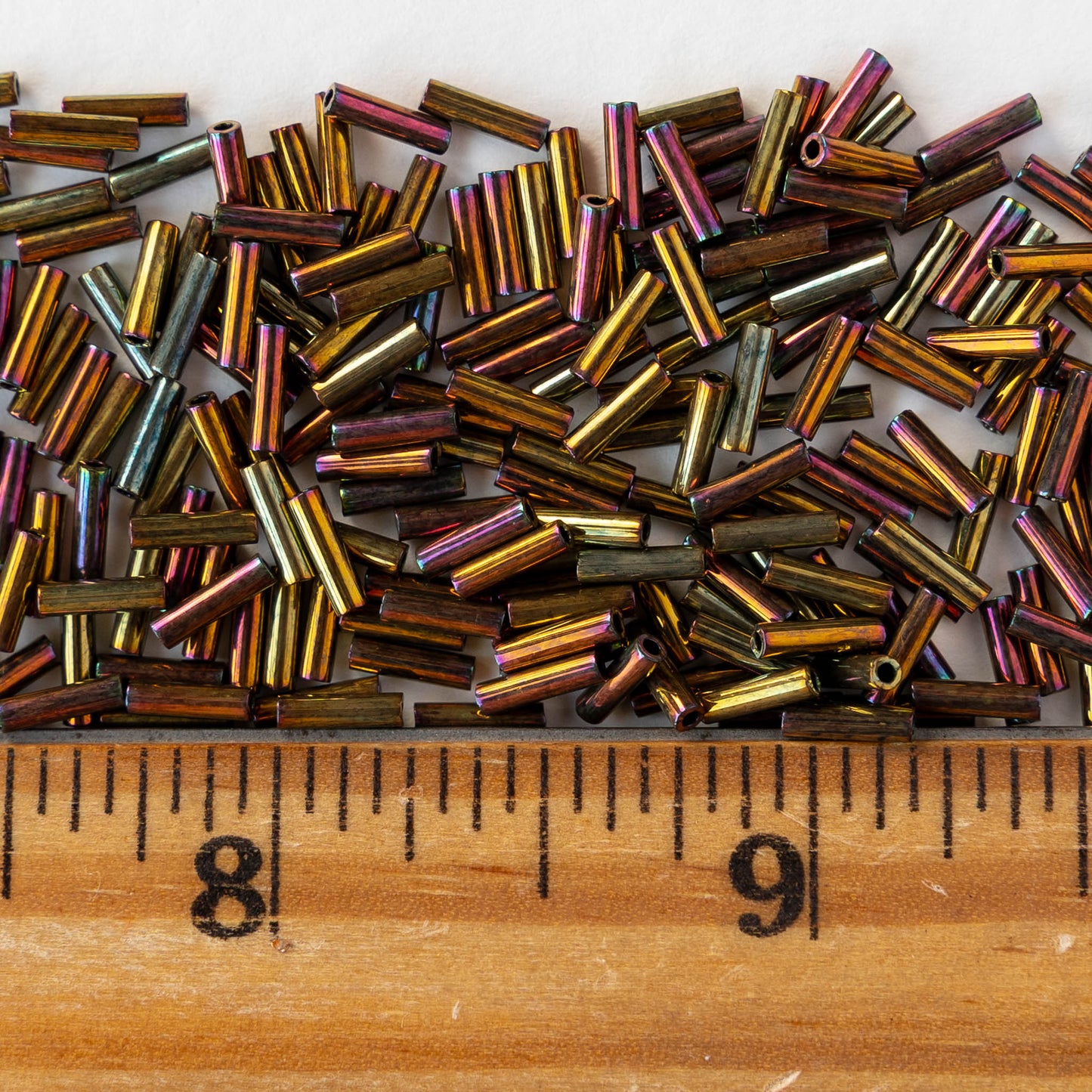 6mm Glass Bugle Beads - Metallic Gold Iris - 5 grams