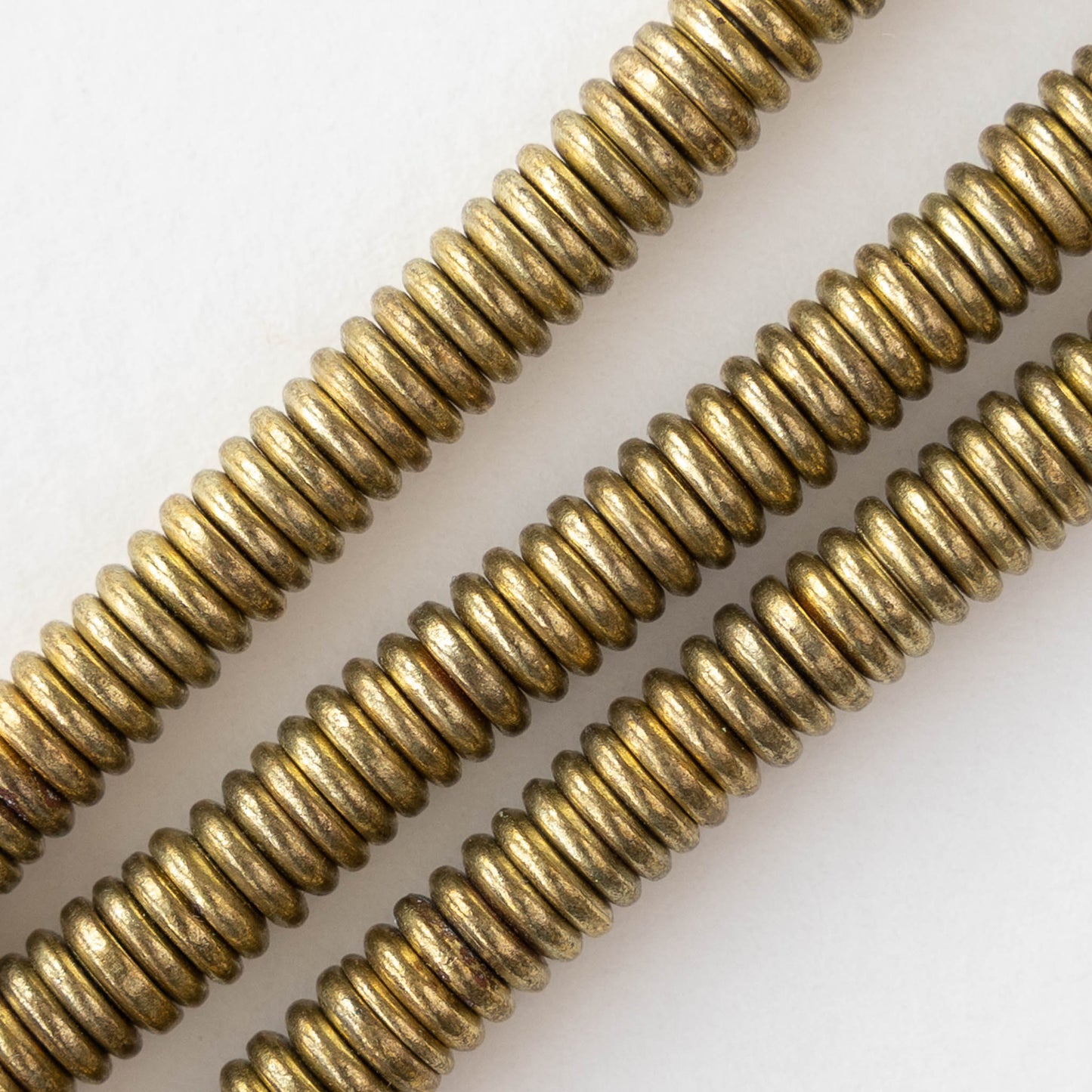 6mm Metal Disk Beads - Antique Brass - 3 inch strand ~40 beads