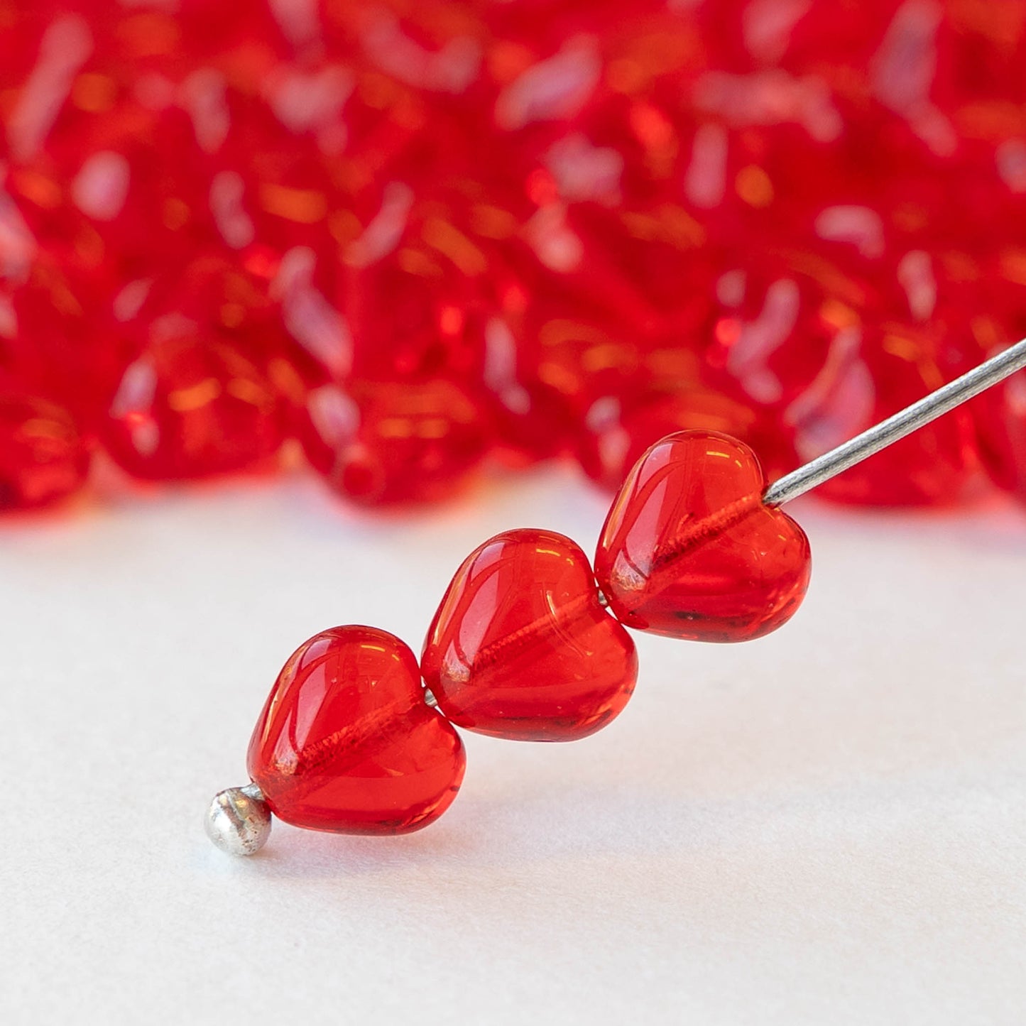 6mm Glass Heart Beads - Transparent Red - 25 hearts