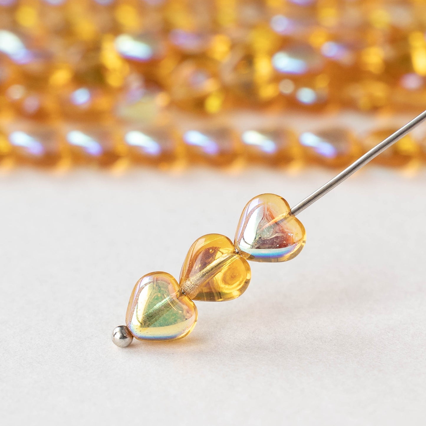 6mm Glass Heart Beads - Topaz AB - 50 hearts