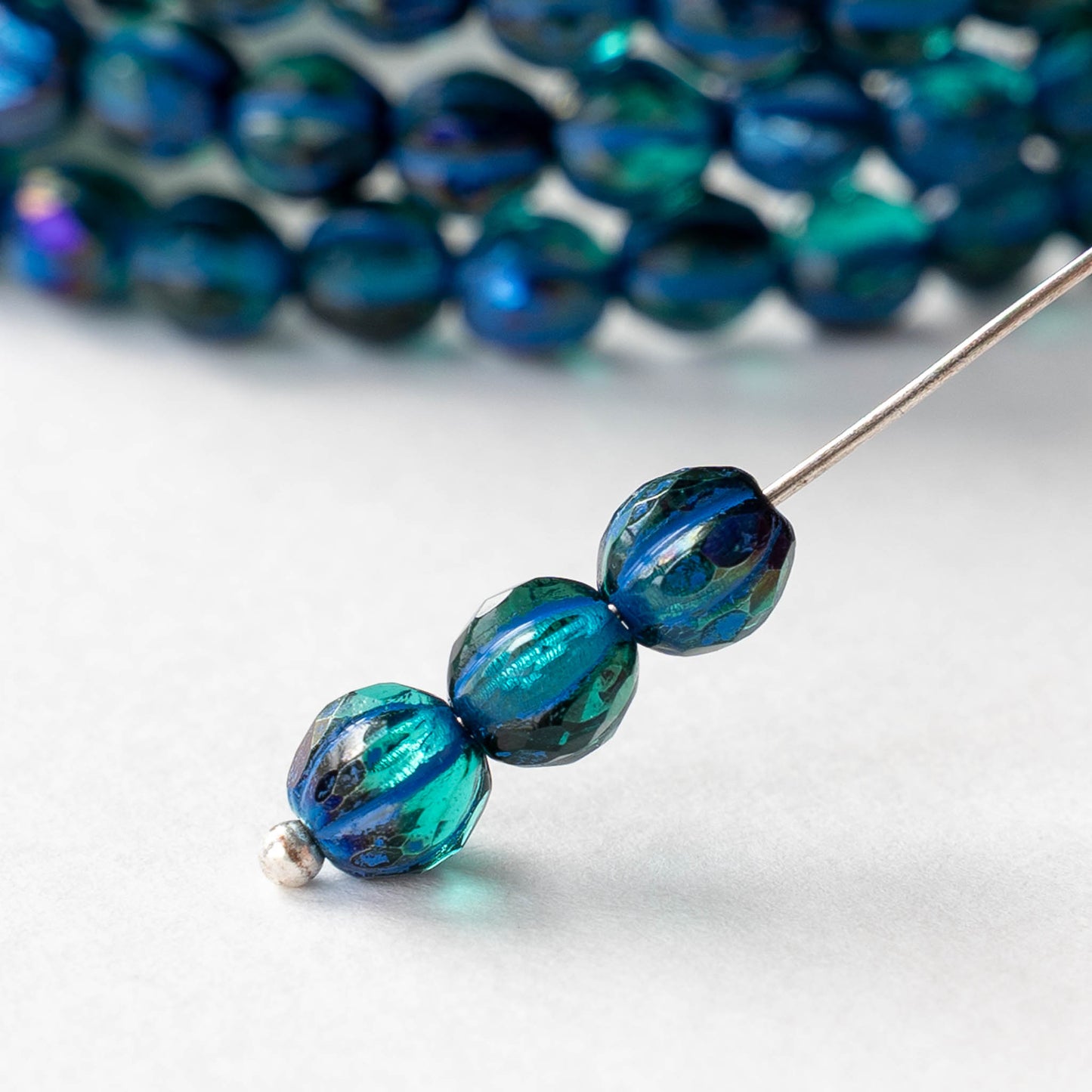 6mm Faceted Round Glass Melon Bead - Emerald AB with Blue Wash - 10 or 30 Beads