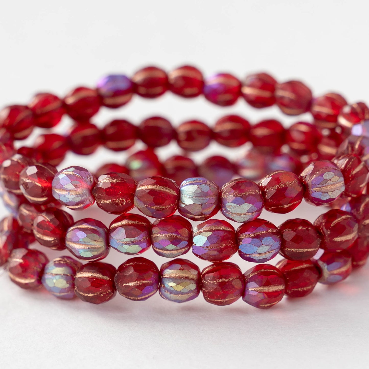 6mm Faceted Round Glass Melon Bead - Transparent Red AB with a Gold Wash - 10 or 20 Beads