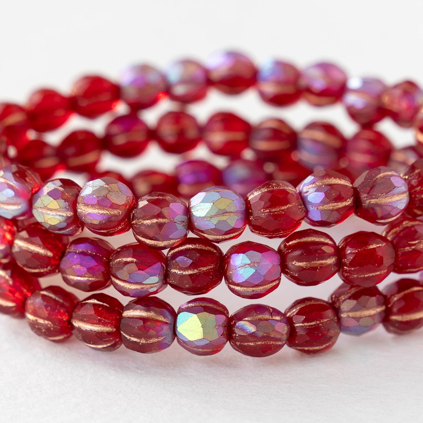 6mm Faceted Round Glass Melon Bead - Transparent Red AB with a Gold Wash - 10 or 20 Beads