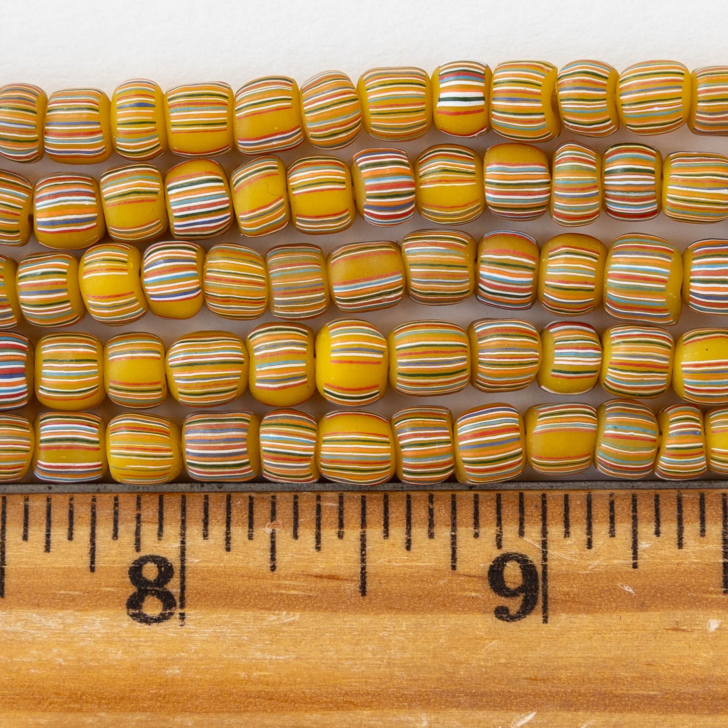 Glass Java Beads - Opaque Yellow with Colorful Stripes - Whole or Half Strand