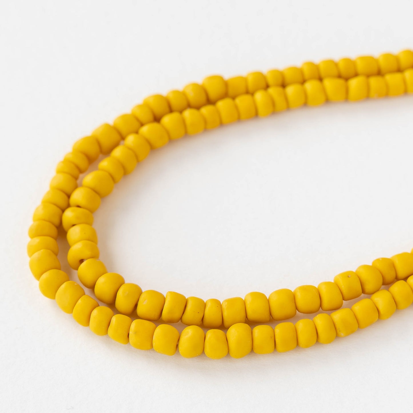 Glass Java Beads - Opaque Yellow - Whole or Half Strand
