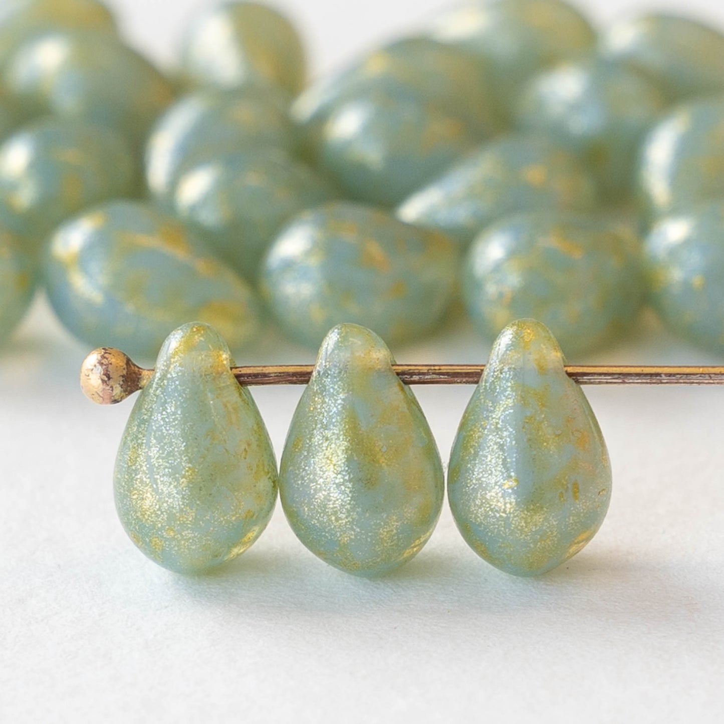 thumbnail image 2 of Handmade Czech Glass Teardrop Beads – Aqua White Blend With Bronze Facets, 19x8mm For Jewelry Making 2 of 5