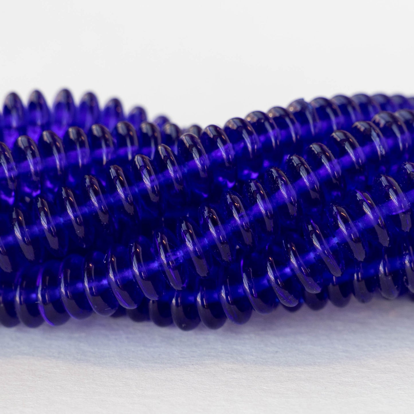 Load image into Gallery viewer, 7mm Rondelle Beads - Cobalt Blue - 100 Beads
