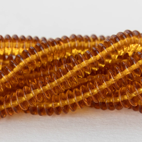 7mm Rondelle Beads - Md. Amber - 100 Beads