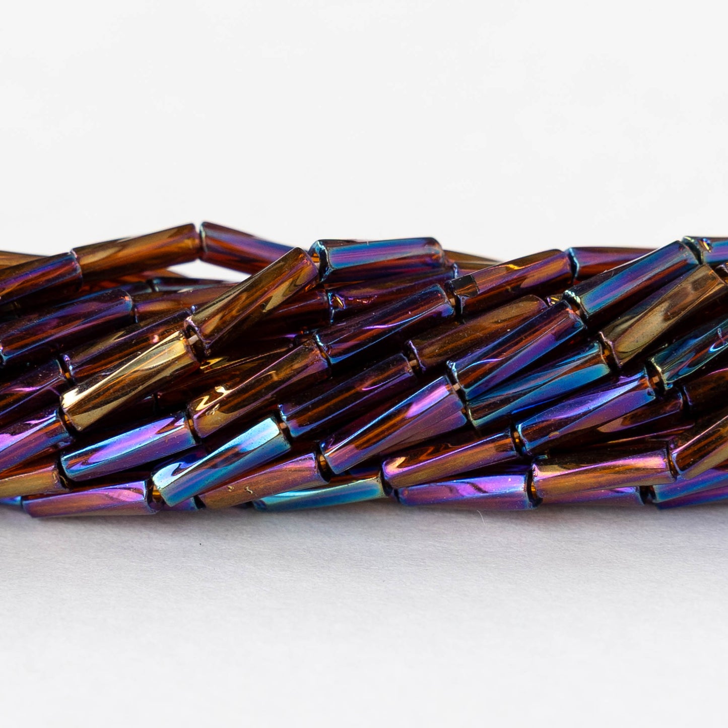 7mm Twisted Bugle Beads - Metallic Brown Rainbow - 20 inch strand ~80 beads