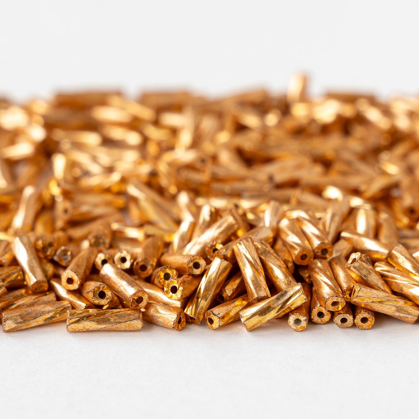 7mm Twisted Bugle Beads - Metallic Gold - 20 grams