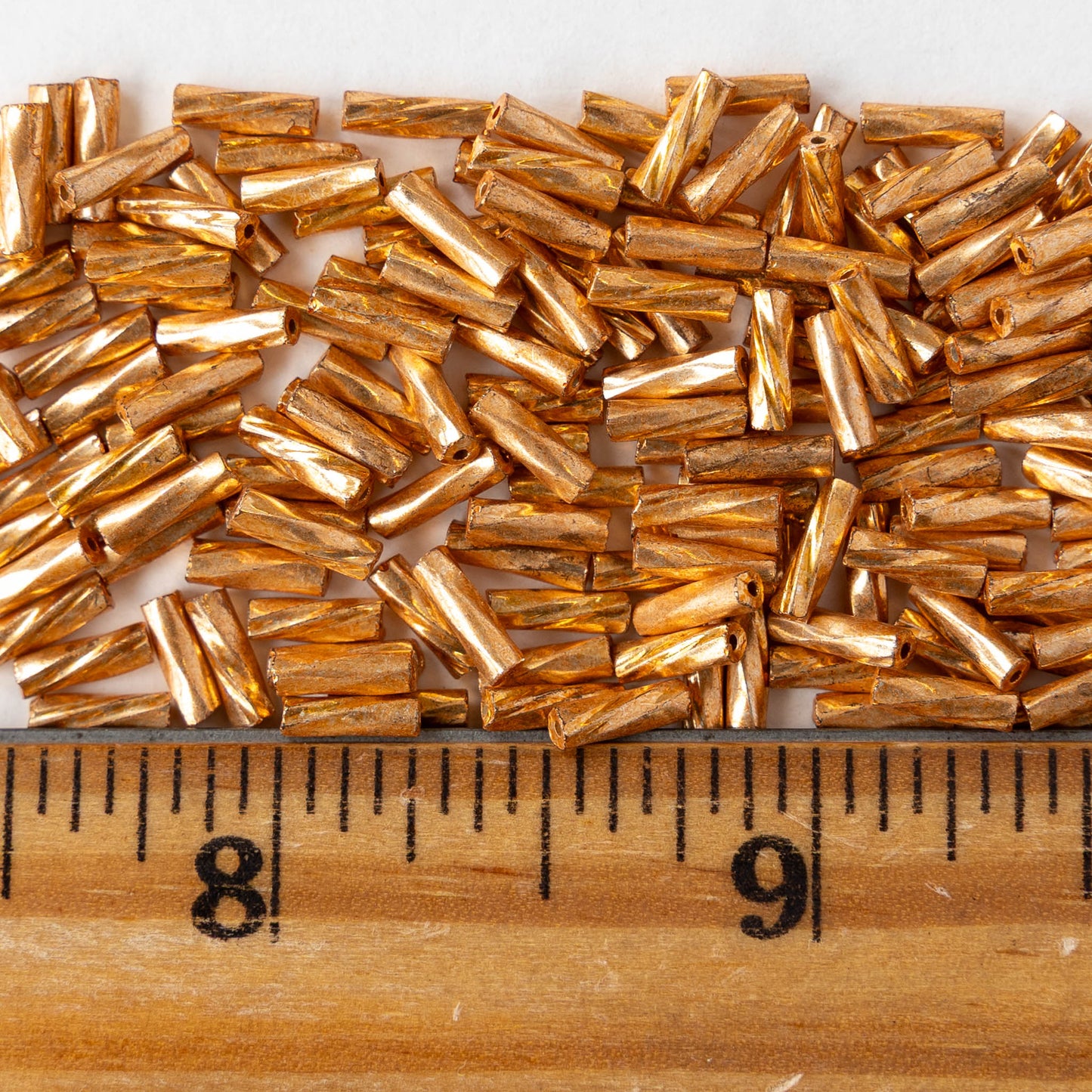 7mm Twisted Bugle Beads - Metallic Gold - 20 grams